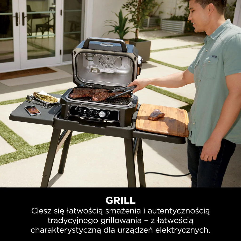 Ninja Woodfire Grill elektryczny, wędzarnia i frytkownica beztłuszczowa, 7 w 1, zewnętrzny, wędzenie, opiekanie, ciasta, odporny na pogodę, nieprzywierający, przenośny, szary/czarny OG701EU