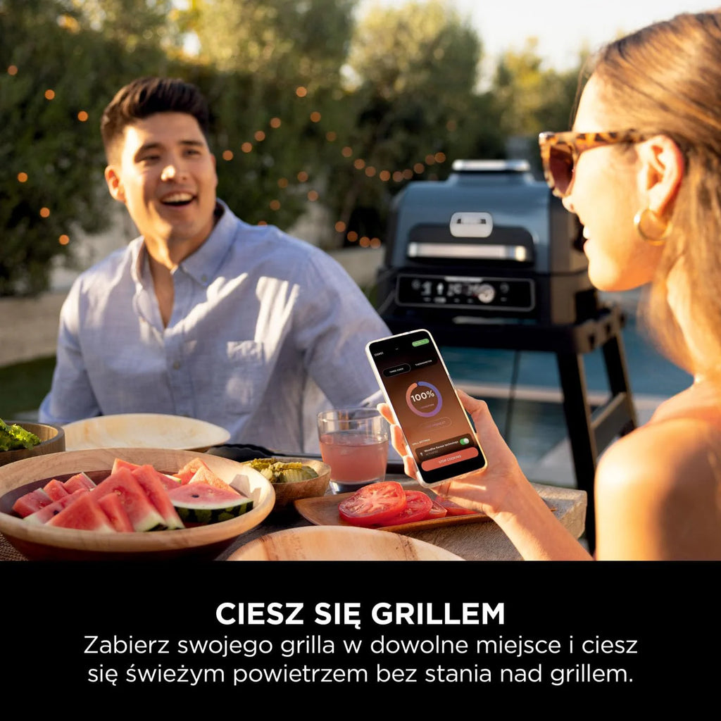 Ninja Woodfire Grill elektryczny, wędzarnia i frytkownica beztłuszczowa, 7 w 1, zewnętrzny, wędzenie, opiekanie, ciasta, odporny na pogodę, nieprzywierający, przenośny, szary/czarny OG701EU